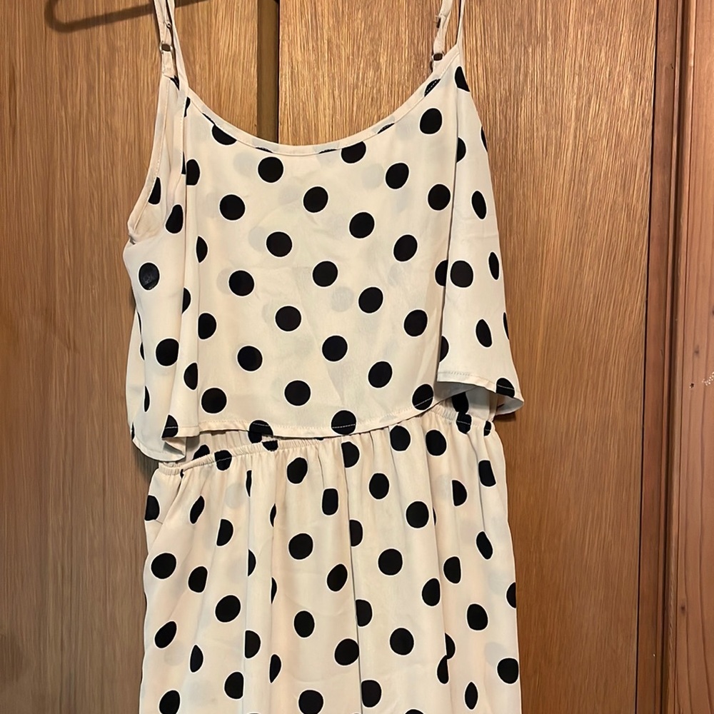 Cute black polka dot and tan  Dress. It does come about mid thigh.
